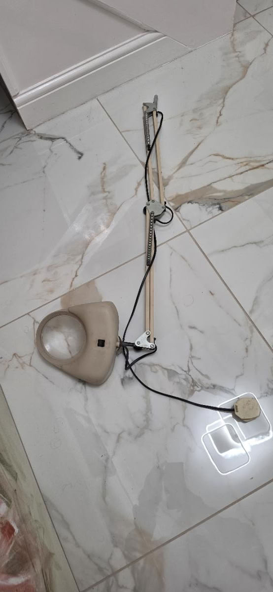 Desk lamp with magnifying glass