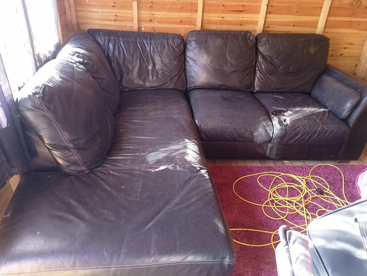 Old leather L shaped sofa