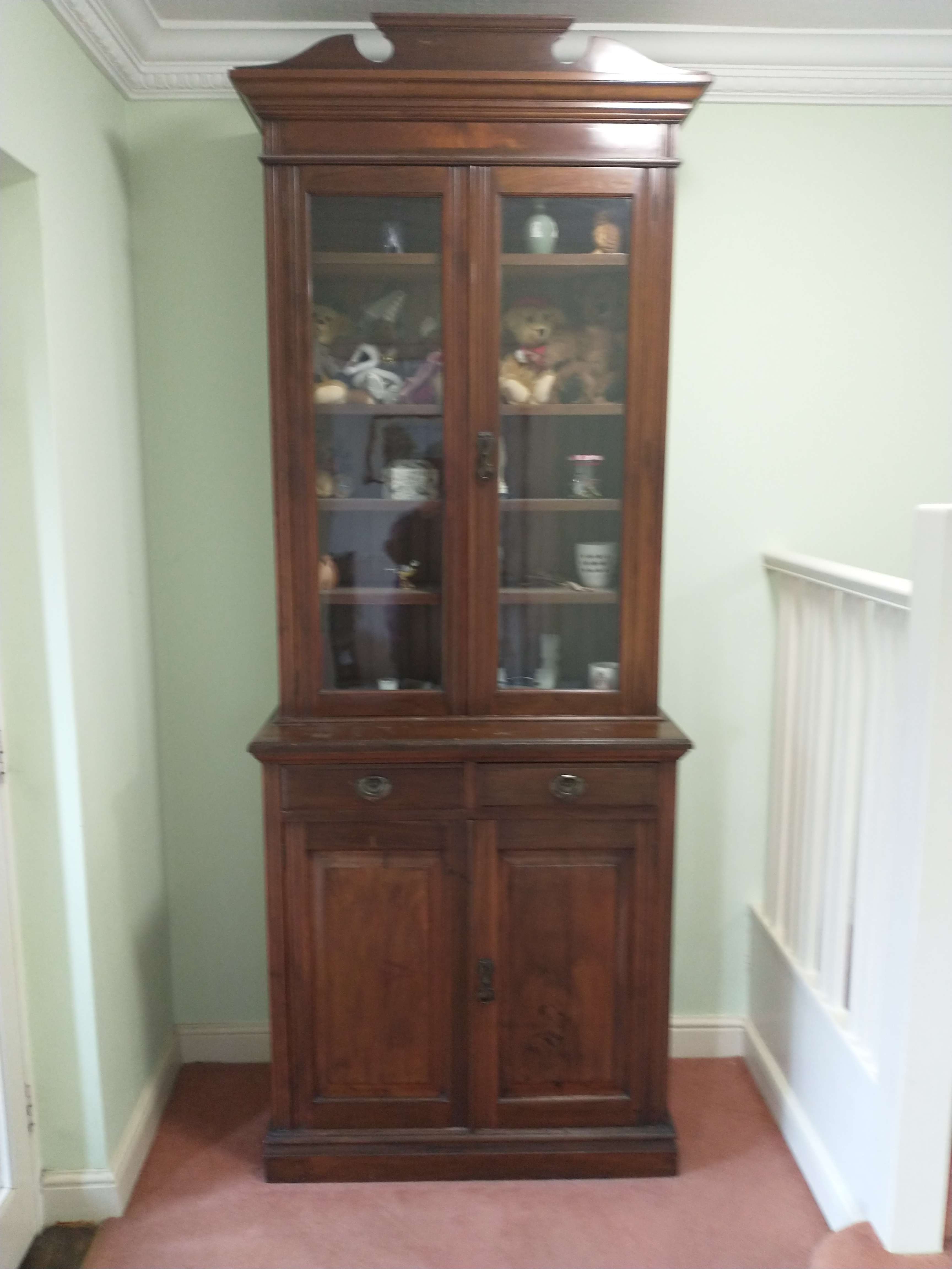 an antique display cabinet or bookcase