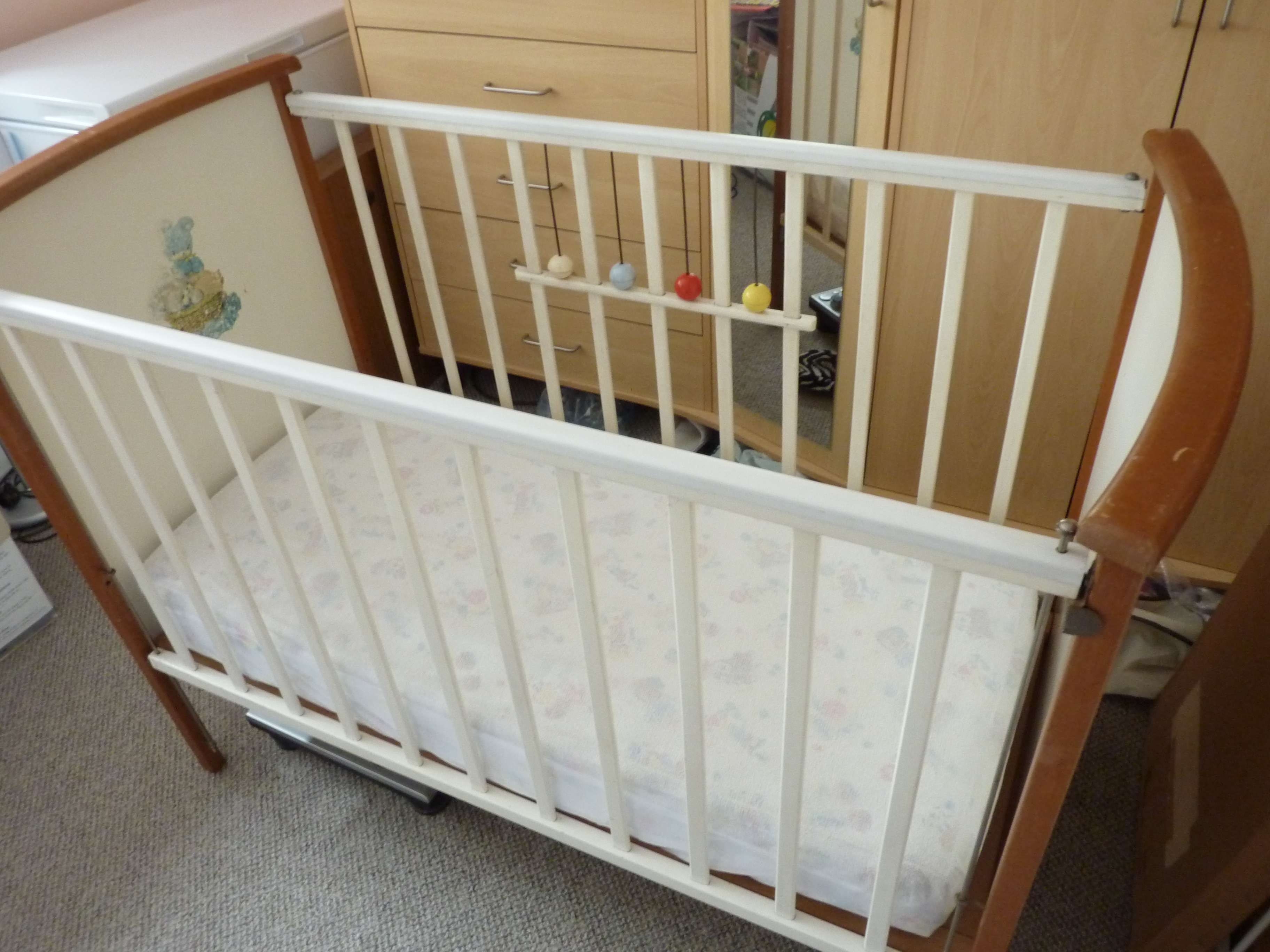 Wooden cot and mattress