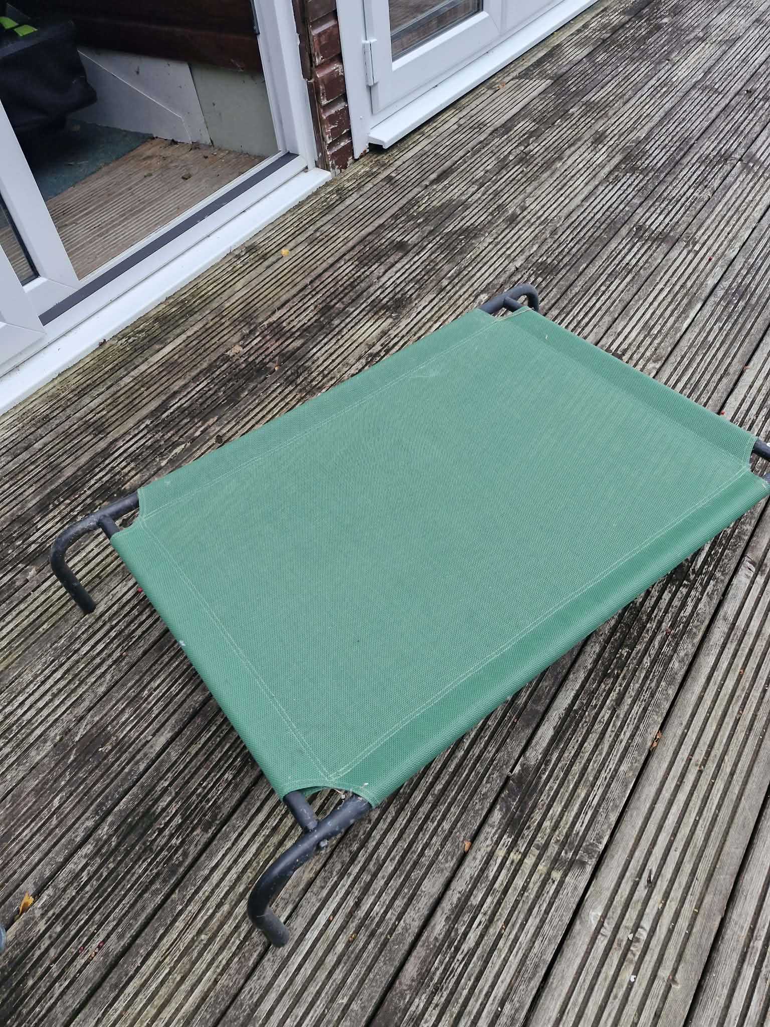 Metal framed dog bed with legs